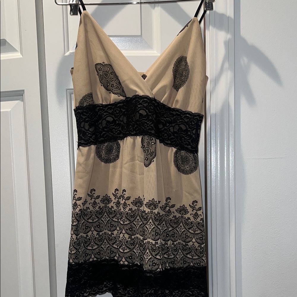 White House Black Market  Beige and Black Lace going out top. Size Small NWT